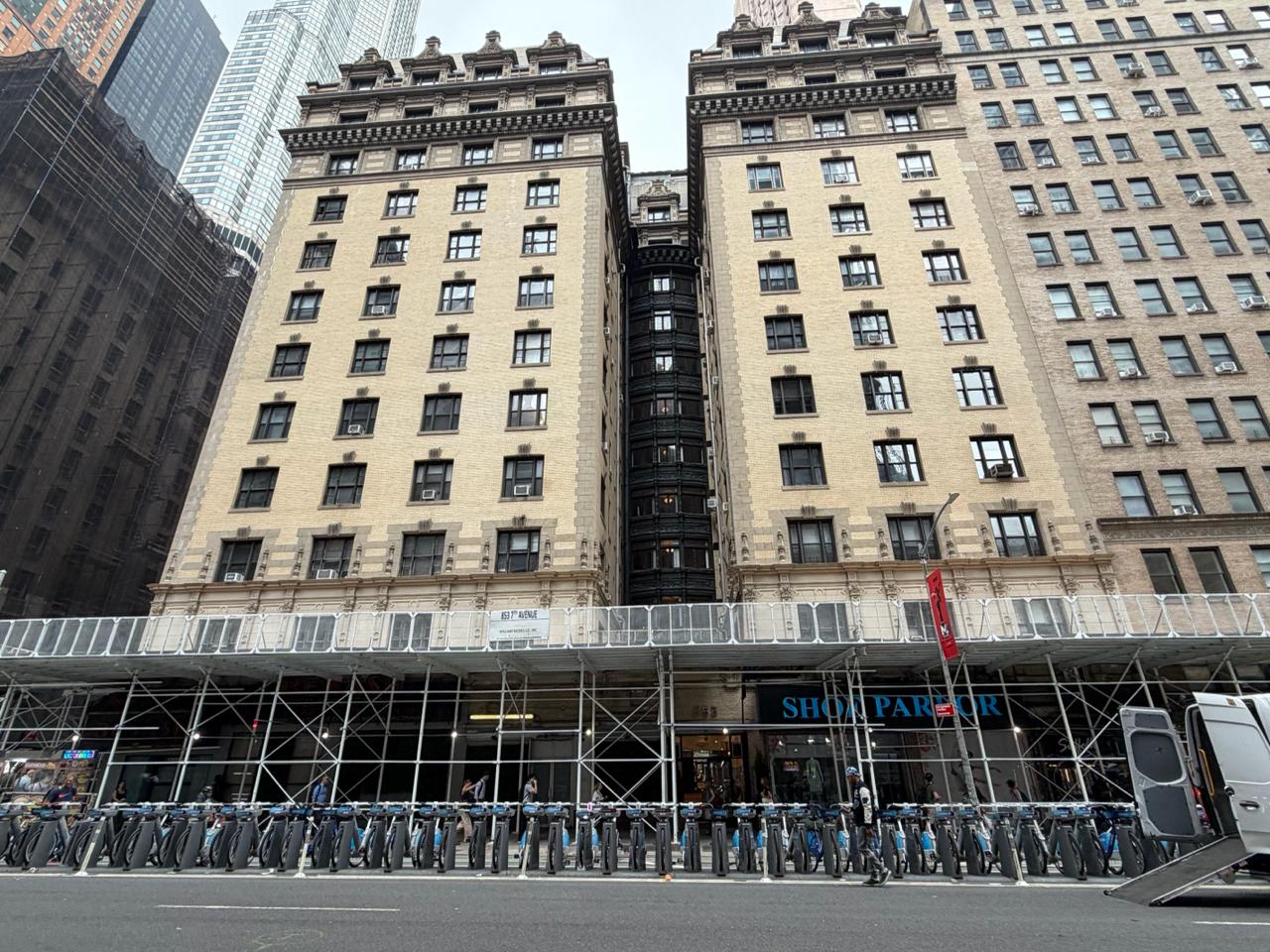 The Wyoming, 849-853 Seventh Avenue, under its replacement sidewalk shed, July 2026.