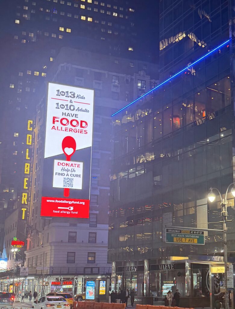 The LED sign on the Ameritania Hotel at 230 West 54th Street lit at night, seen from Broadway, April 8, 2026